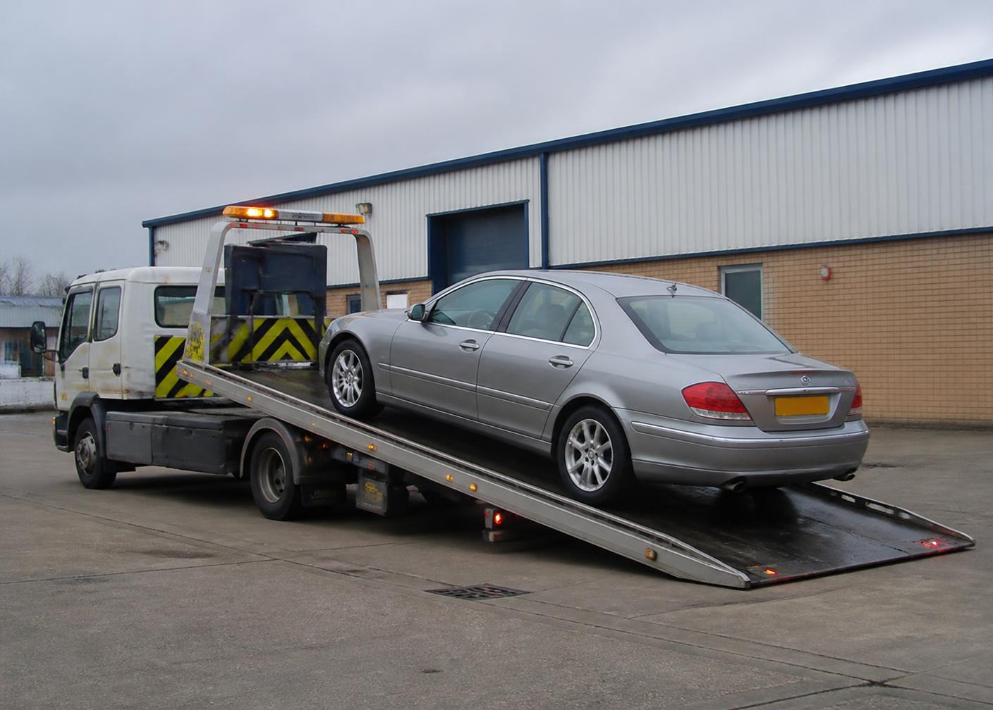 Recovery truck loading a vehicle